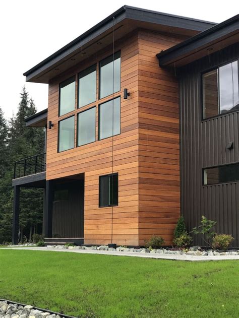 black metal siding house light wood|metal siding colors.